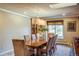 Dining area with large wooden table, comfortable seating, and stylish lighting fixtures at 40 Charlou Cir, Cherry Hills Village, CO 80111