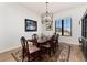 Elegant dining room with hardwood floors and a chandelier at 8186 Donatello Ct, Littleton, CO 80125