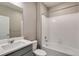Clean bathroom with a shower-tub combo, toilet, and vanity with sink and faucet at 13486 Valentia St, Thornton, CO 80602