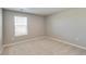 Neutral bedroom with carpet, a window with blinds, and white trim at 13486 Valentia St, Thornton, CO 80602