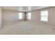Spacious carpeted bonus room with three windows offers plenty of natural light at 13486 Valentia St, Thornton, CO 80602