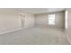 Neutral carpeted bonus room with a window and entry to a walk-in closet at 13486 Valentia St, Thornton, CO 80602