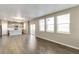 Spacious living area with hardwood floors, bright natural light, and an open layout at 13486 Valentia St, Thornton, CO 80602