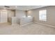 Upstairs loft area with neutral carpet and a window for natural light at 13486 Valentia St, Thornton, CO 80602
