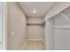 Walk-in closet offering ample storage with shelving and rods at 13486 Valentia St, Thornton, CO 80602