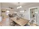 Open-concept dining area flows seamlessly into a cozy living space at 3280 Fenton St, Wheat Ridge, CO 80212