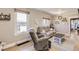 Cozy living room with warm hardwood floors and comfortable seating at 3280 Fenton St, Wheat Ridge, CO 80212