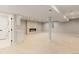 Spacious finished basement featuring a modern fireplace and plenty of room to relax at 2552 E Alameda Ave # 92, Denver, CO 80209
