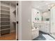Spa-like bathroom showcasing sleek fixtures, modern shower, and open closet space at 2552 E Alameda Ave # 92, Denver, CO 80209