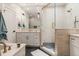 Bright bathroom featuring a glass shower, vanity with a large mirror, and modern fixtures at 2552 E Alameda Ave # 92, Denver, CO 80209