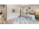Bright bedroom featuring a queen size bed, modern rug, and stylish decor at 2552 E Alameda Ave # 92, Denver, CO 80209