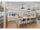 Spacious kitchen featuring a large center island with barstool seating and modern stainless steel appliances at 2552 E Alameda Ave # 92, Denver, CO 80209