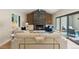 Inviting living room featuring a modern fireplace, wood accents and seamless flow to an outdoor patio at 2552 E Alameda Ave # 92, Denver, CO 80209