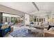 Open concept living space featuring kitchen view and access to the outdoor space at 2552 E Alameda Ave # 92, Denver, CO 80209