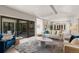 Living room with seamless indoor-outdoor flow, and view of dining and kitchen areas at 2552 E Alameda Ave # 92, Denver, CO 80209
