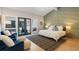 Cozy main bedroom boasting outdoor access, stylish accents and plenty of natural light at 2552 E Alameda Ave # 92, Denver, CO 80209