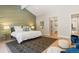 Stylish main bedroom featuring an ensuite bathroom, walk-in closet and unique design elements at 2552 E Alameda Ave # 92, Denver, CO 80209