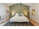 Charming main bedroom showcasing unique wall detail, and bright, light-filled windows at 2552 E Alameda Ave # 92, Denver, CO 80209