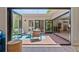 Open patio featuring bi-fold doors connecting indoor and outdoor living spaces with modern decor at 2552 E Alameda Ave # 92, Denver, CO 80209