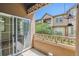 Balcony overlooking green common area has sliding door to inside the home at 11972 W Long Cir # 104, Littleton, CO 80127