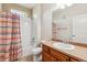 Well-maintained bathroom features a shower-tub combo and a vanity with ample countertop space at 11972 W Long Cir # 104, Littleton, CO 80127