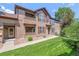Charming two-story townhome with a well-maintained lawn and inviting facade at 11972 W Long Cir # 104, Littleton, CO 80127