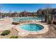 Community hot tub and pool area provides a relaxing outdoor space for residents to enjoy on beautiful sunny days at 11972 W Long Cir # 104, Littleton, CO 80127