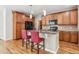 Kitchen with granite countertops, stainless steel appliances, and hardwood floors at 11972 W Long Cir # 104, Littleton, CO 80127