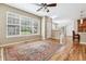 Bright living room with large windows, hardwood floors, and an open floor plan at 11972 W Long Cir # 104, Littleton, CO 80127