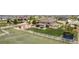 A backyard with a trampoline, patio, play area, and well-manicured lawn at 10653 E 163Rd Ct, Brighton, CO 80602