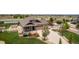 An aerial shot of a well-landscaped home featuring a long drive way at 10653 E 163Rd Ct, Brighton, CO 80602