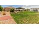 Inviting backyard with a pergola-covered patio and a well-maintained lawn at 10653 E 163Rd Ct, Brighton, CO 80602