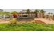 The backyard features a pen area, shed, grass lawn, and decorative landscaping at 10653 E 163Rd Ct, Brighton, CO 80602