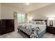 Cozy bedroom with a window and side tables with lamps at 10653 E 163Rd Ct, Brighton, CO 80602
