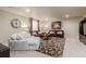 Comfortable living room featuring plush seating, neutral walls, and a decorative rug at 10653 E 163Rd Ct, Brighton, CO 80602