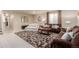 Inviting living room with plush sofas, decorative rug, and ample space for relaxation at 10653 E 163Rd Ct, Brighton, CO 80602