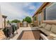Covered patio boasts comfortable seating, a grill, and scenic views at 10653 E 163Rd Ct, Brighton, CO 80602