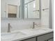 Modern bathroom with double vanity and quartz countertop at 6153 N Ceylon St # 201, Denver, CO 80249