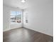 Bright bedroom with two large windows and wood-look floors at 6153 N Ceylon St # 201, Denver, CO 80249