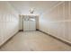 Spacious garage with overhead door and drywall at 6153 N Ceylon St # 201, Denver, CO 80249
