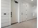 Bright hallway with white walls and doors leading to various rooms at 6153 N Ceylon St # 201, Denver, CO 80249