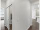 Clean and modern hallway with light walls and hardwood floors at 6153 N Ceylon St # 201, Denver, CO 80249