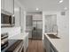 Modern kitchen with stainless steel appliances and gray cabinets at 6153 N Ceylon St # 201, Denver, CO 80249
