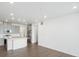 Modern kitchen featuring gray cabinets and stainless steel appliances at 6153 N Ceylon St # 201, Denver, CO 80249