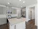 Modern kitchen with gray cabinets, stainless steel appliances, and an island at 6153 N Ceylon St # 201, Denver, CO 80249