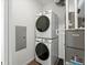 Stackable washer and dryer with Lennox furnace in a small room at 6153 N Ceylon St # 201, Denver, CO 80249