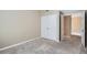 Neutral bedroom with carpet and double doors to the closet at 7493 S Quail Cir # 928, Littleton, CO 80127