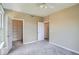Bright bedroom featuring a closet with shelving and neutral carpet at 7493 S Quail Cir # 928, Littleton, CO 80127