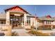 Clubhouse entrance with native plantings and an American flag at 7493 S Quail Cir # 928, Littleton, CO 80127