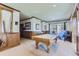 Spacious game room with a pool table, wood paneled walls, and stylish lighting at 7493 S Quail Cir # 928, Littleton, CO 80127